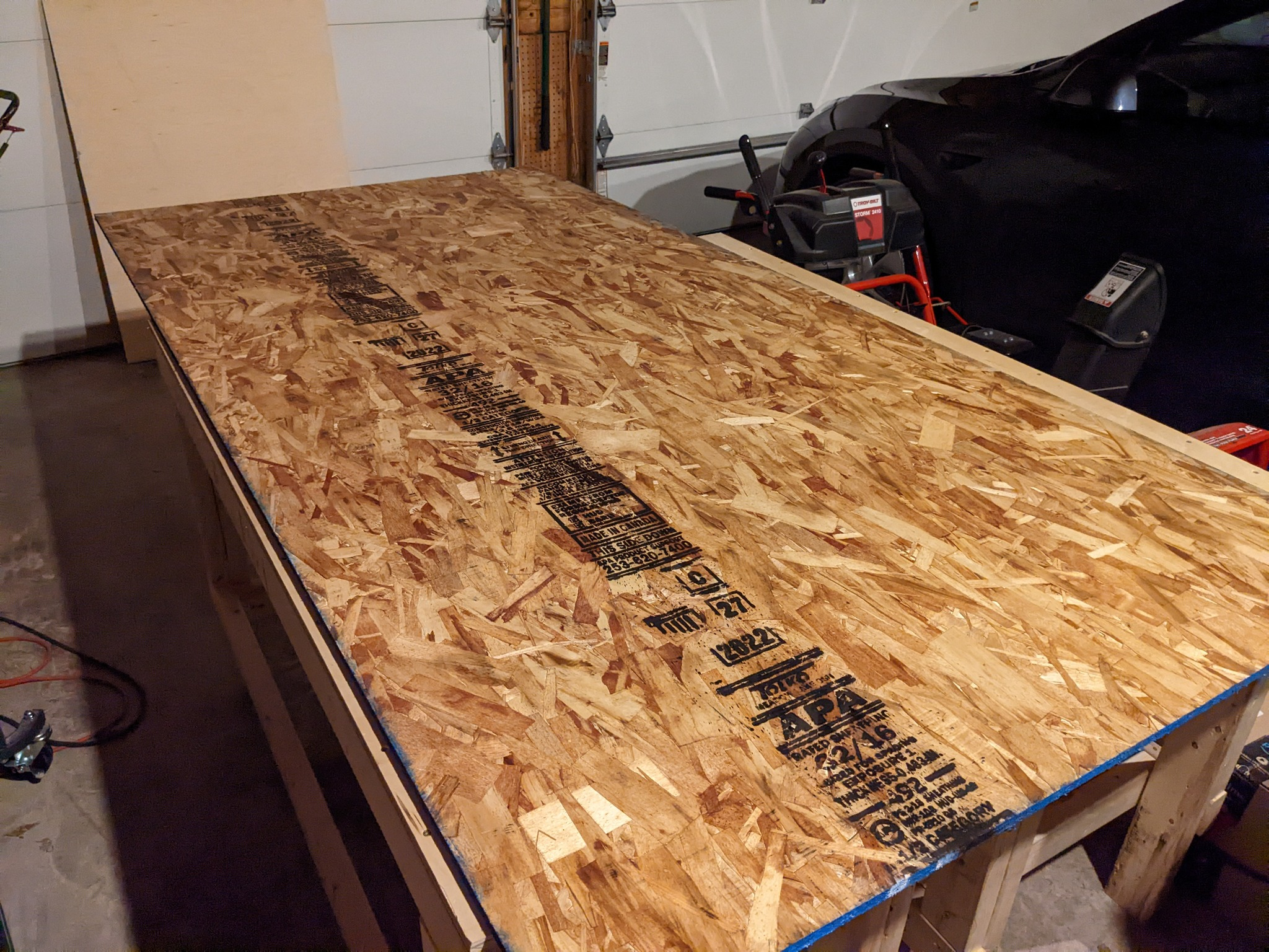 Plywood sitting on some workbenches