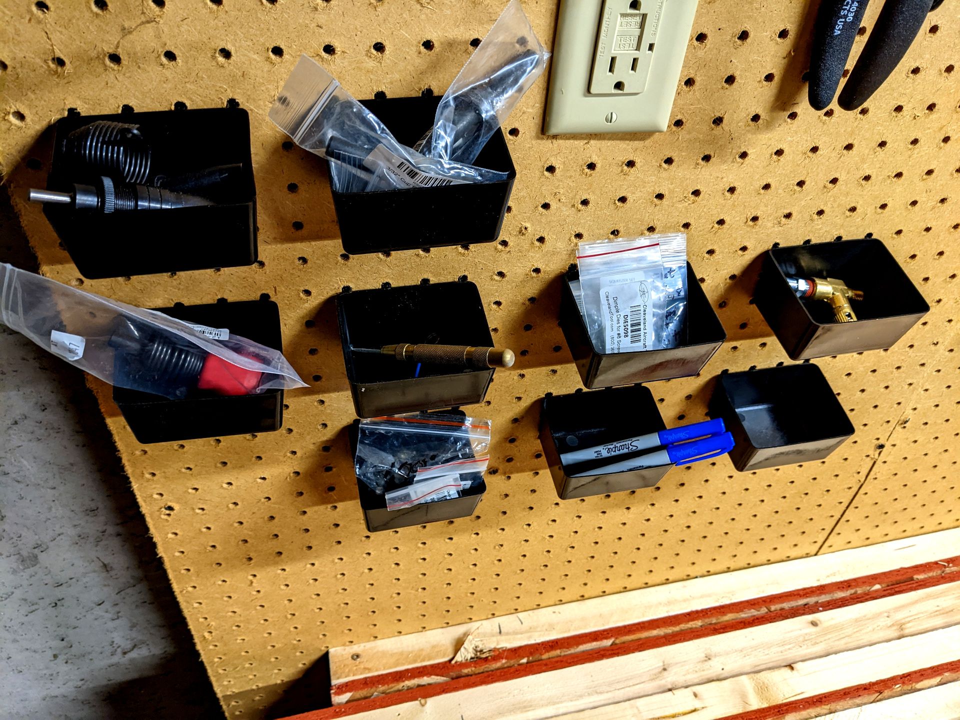 Close up of pegboard bins