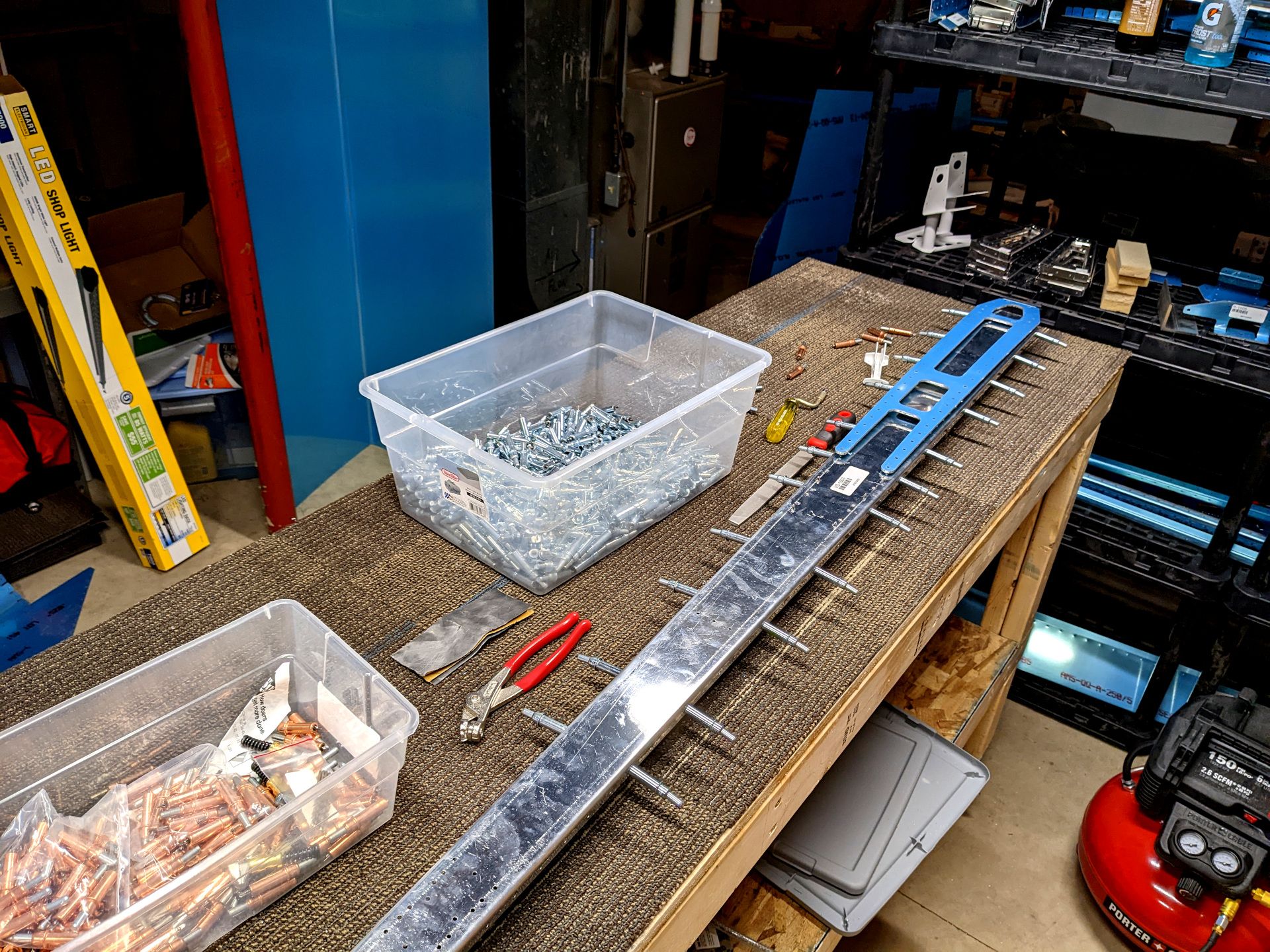 A reinforcement plate wrapped in blue vinyl sitting on top of the rear spar