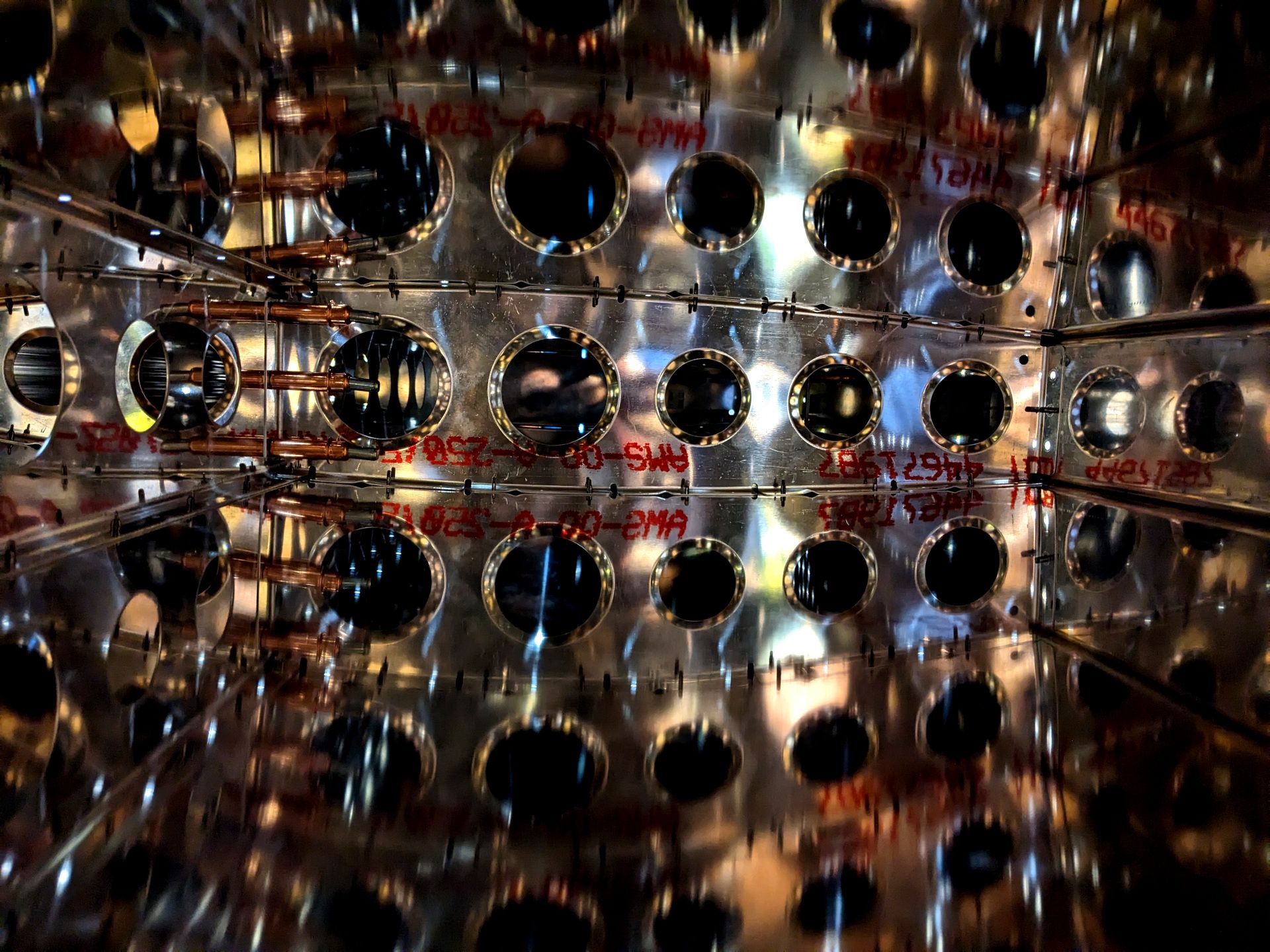 Inside of the vertical stabilizer. There are many reflections causing the ribs to show multiple times as if stacked to infinity