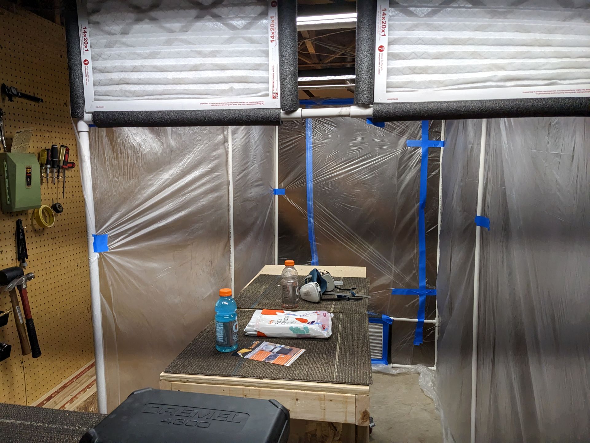 PVC paint booth with plastic curtains installed and taped up